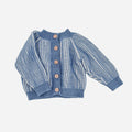 Blue and white striped baby cardigan with buttons on a light blue background